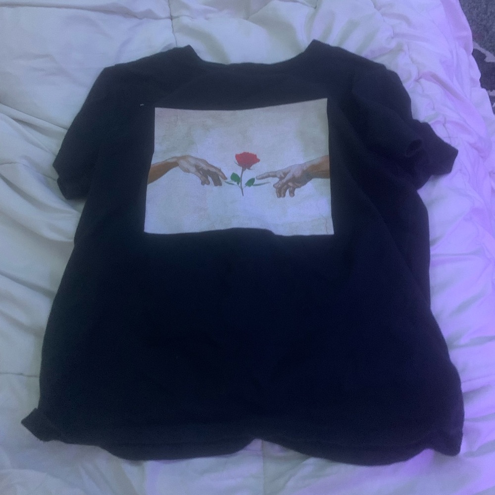 Artistic Black Tee with Hands and Rose Design